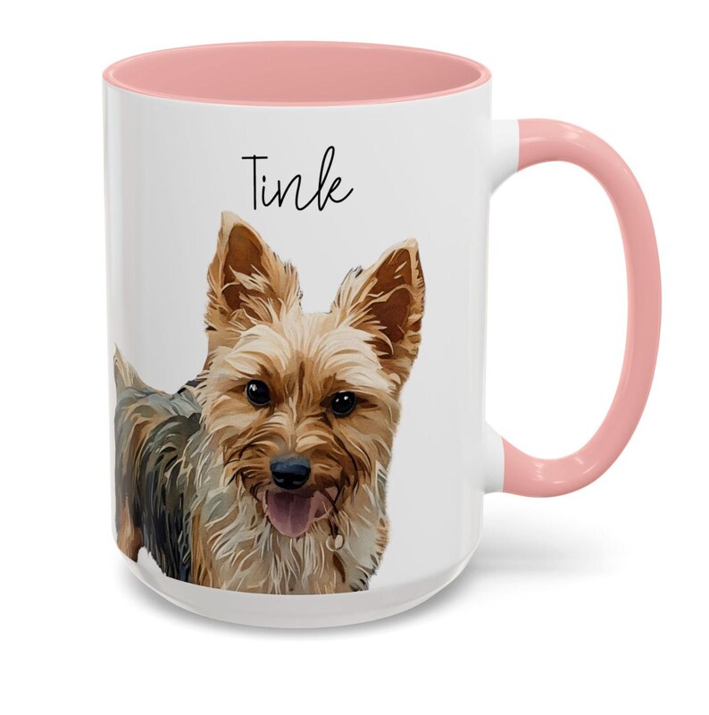 May include: White ceramic mug with a pink interior and handle. The mug features a portrait of a Yorkshire Terrier dog with the name "Tink" in black script. The dog has brown and black fur.
