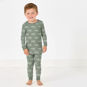 May include: A rustic wooden sign with the text "Welcome to our home" in a handwritten style. The sign features a distressed finish and a simple, inviting design, perfect for a front porch or entryway.