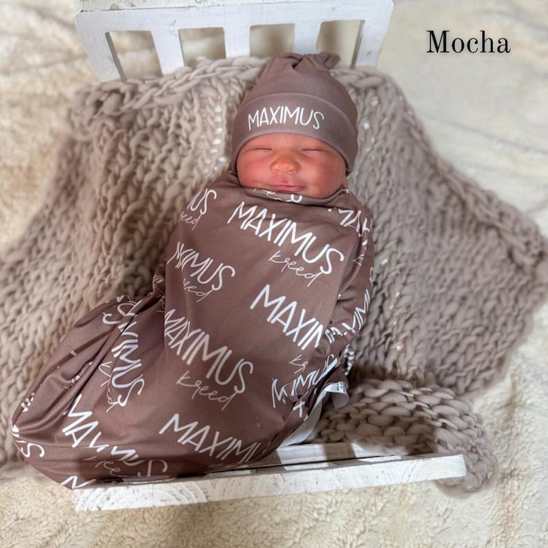 Personalized newborn swaddle with custom name blanket, ideal for hospital photos, coming home outfit pictures, and newborn photography props. A popular baby shower gift that creates lasting memories and beautiful keepsake photos.