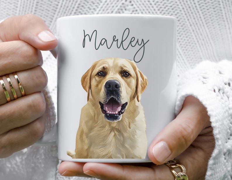 May include: White ceramic mug featuring a golden Labrador Retriever portrait with the name "Marley" in script. The dog's open mouth and pink tongue are visible. A personalized pet-themed gift.