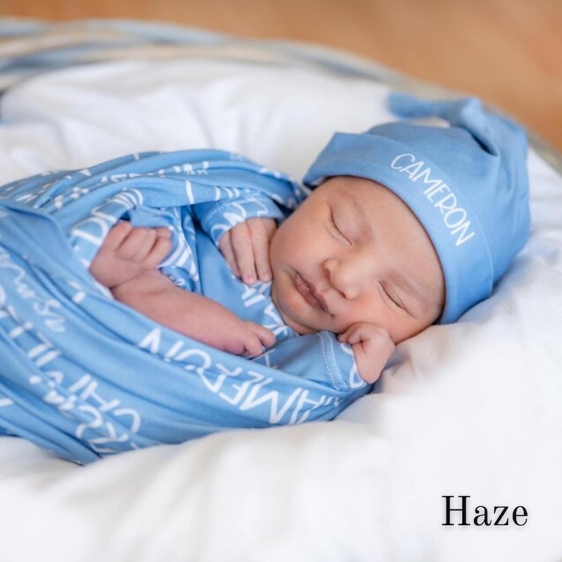 Newborn name swaddle bundle featuring a personalized baby blanket and matching swaddle. Designed for professional photo sessions, hospital homecoming outfits, and birth announcement photos. A modern, neutral baby gift perfect for baby showers.