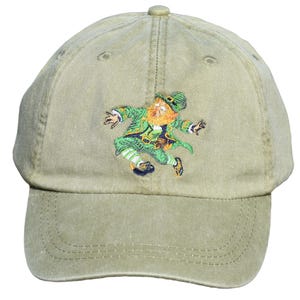May include: A green baseball cap with an embroidered image of a leprechaun wearing a green hat and holding a pot of gold.
