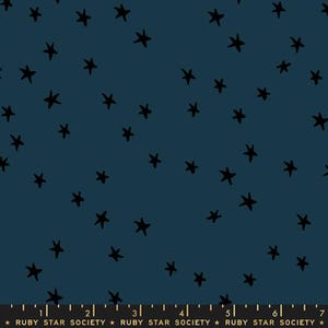 May include: Dark teal fabric with a scattered pattern of black, hand-drawn stars. The stars vary in size and are evenly distributed across the surface. The bottom of the image shows the text "RUBY STAR SOCIETY".