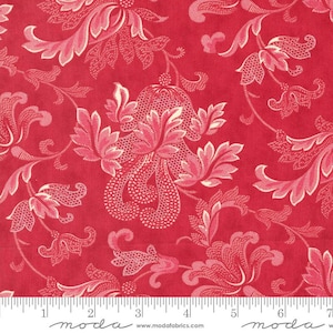 May include: Red fabric with a repeating floral pattern in shades of pink and cream. The design features stylized flowers and leaves with intricate detailing. The fabric has a textured appearance and is suitable for various sewing projects.