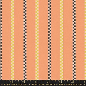 May include: Peach-colored fabric with vertical stripes. Alternating stripes feature black and yellow checkered patterns. The text "RUBY STAR SOCIETY" is printed along the bottom edge of the fabric.