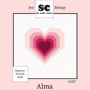 May include: A pink and white quilt pattern with a large heart design in the center. The heart is made up of multiple layers of pink and red fabric. The pattern is called "Alma" and is described as "Spanish for Heart and Soul".