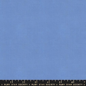 May include: A solid blue fabric swatch with a subtle texture. The fabric is a light blue color and has a smooth, even surface.