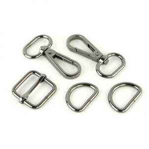 May include: A set of five gunmetal-colored metal hardware pieces for bags and other crafts. The set includes two D-rings, a square buckle, and two swivel clasps.