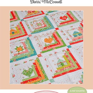 May include: A colorful quilt with a patchwork design featuring squares with hearts, houses, and stars. The quilt has a white background with red, green, orange, and blue accents. The text "Summer House" is displayed on the bottom.