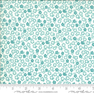 May include: White fabric with a teal floral pattern. The fabric is covered in small, evenly spaced teal flowers with a white outline. The fabric is measured in inches.