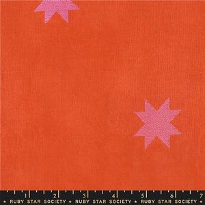 May include: Bright orange fabric with a repeating pattern of pink star shapes. The fabric has a textured appearance. The bottom of the image has the text "RUBY STAR SOCIETY".