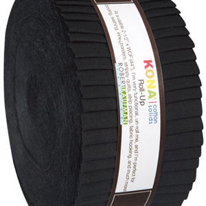 May include: A roll-up of black Kona cotton solids fabric. The fabric is wrapped with a brown label that reads "KONA Cotton Solids Roll-Up". The roll contains strips of fabric, each approximately 2.5 inches wide.