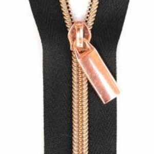 May include: Black zipper with a rose gold slider and pull. The zipper tape is black and the zipper teeth are rose gold.