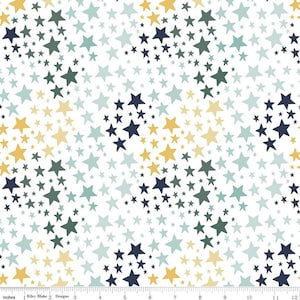 May include: A white fabric with a repeating pattern of stars in various sizes and shades of blue, green, and yellow.