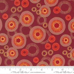 May include: Red fabric with a repeating pattern of concentric circles in shades of orange, yellow, and pink. The circles are outlined in brown and have a textured appearance.