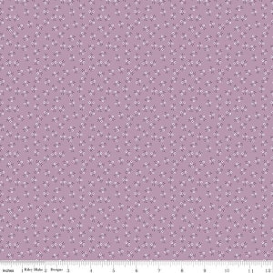 May include: A purple fabric with a repeating pattern of small white flowers and leaves. The fabric is measured in inches.