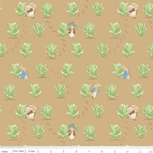 May include: Fabric with a repeating pattern featuring illustrations of rabbits, lettuce, and footprints on a tan background. The rabbits are depicted in various poses, some wearing blue jackets. The lettuce is green, and the footprints are brown.