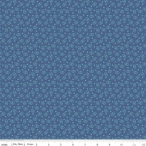 May include: A blue fabric with a repeating pattern of light blue circles and double circles. The fabric is 12 inches wide.