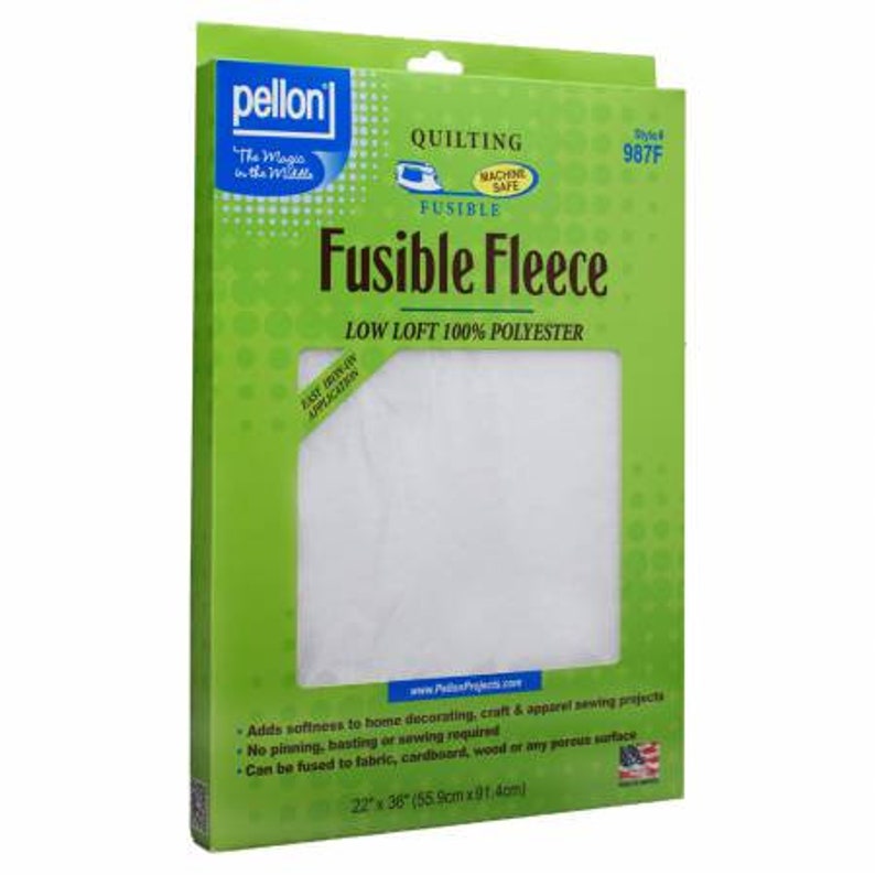 May include: A green and white package of Pellon Fusible Fleece, a low loft 100% polyester quilting fabric. The package shows a white piece of fabric with the text "Fusible Fleece" and "Low Loft 100% Polyester" printed on it. The package also includes the text "Machine Safe" and "Style 987F".