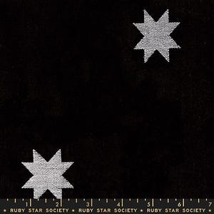 May include: Black fabric with two white, eight-pointed stars. The stars have a textured, dotted pattern. The bottom of the image has a ruler with the text "RUBY STAR SOCIETY".