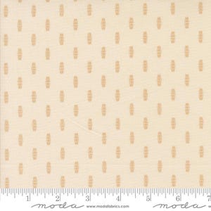 May include: Cream-colored fabric with a repeating pattern of small, vertical, wheat-like shapes in a light brown hue. The fabric has a subtle texture and a ruler is visible along the bottom edge, marked in inches.