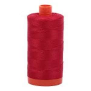 May include: A spool of red sewing thread with an orange plastic bobbin.