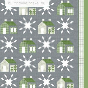 May include: A quilt pattern featuring a repeating design of white snowflakes and green houses with white windows and green trees. The pattern is on a gray background. The text "thimble blossoms by camille roskelley" and "#257" are at the top of the image. The text "ALPINE a cozy 60" x 72" winter quilt" is at the bottom of the image.
