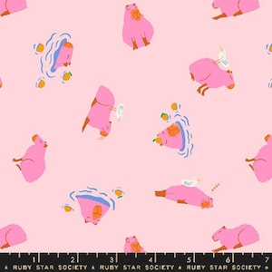 May include: Pink fabric with a repeating pattern of capybaras, birds, and lemons. The capybaras are in various poses, including swimming, sitting, and standing. The birds are flying and perched on the capybaras. The lemons are scattered throughout the pattern.