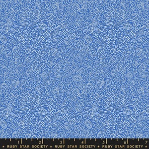 May include: A blue fabric with a white pattern of small squares arranged in a swirling, organic design.