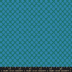May include: A fabric with a repeating pattern of green square-like shapes on a blue background. The pattern is evenly spaced, creating a grid-like appearance. The bottom of the image has text that reads "RUBY STAR SOCIETY".