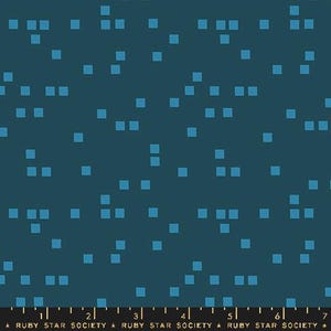 May include: Dark teal fabric with a scattered pattern of small, light blue squares. The squares are arranged in a seemingly random distribution across the fabric. The bottom of the image has a ruler with the text "RUBY STAR SOCIETY".
