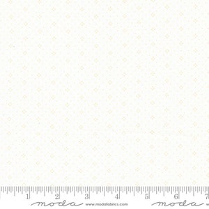 May include: White fabric with a subtle pattern of tiny yellow dots. The fabric is shown with a ruler for scale.