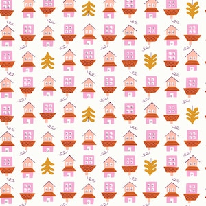 May include: A repeating pattern of pink and peach houses with orange roofs and square windows. The design includes stylized gold trees and leaf shapes on a cream background. The houses have a whimsical, hand-drawn style.