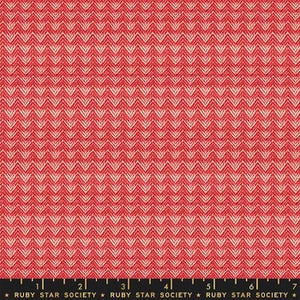 May include: Red and cream-colored fabric with a chevron pattern. The fabric has a woven texture and a repeating design of inverted V shapes. The bottom of the image has the text "RUBY STAR SOCIETY".