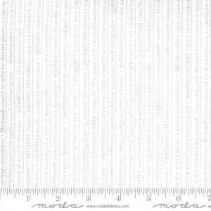May include: A white fabric with a gray and white text pattern. The text includes words like "wanderlust", "solivagant", "petrify", and "anthophile". The fabric is measured with a ruler in inches.