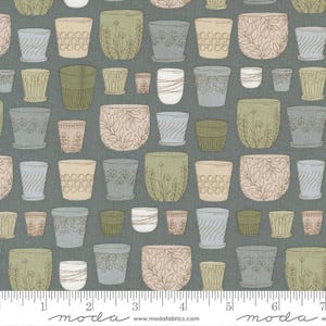 May include: Fabric with a repeating pattern of various sized flower pots in shades of green, beige, and gray. The pots feature different designs, including floral and geometric patterns. The background is a muted gray-green color. The fabric has a ruler along the bottom.