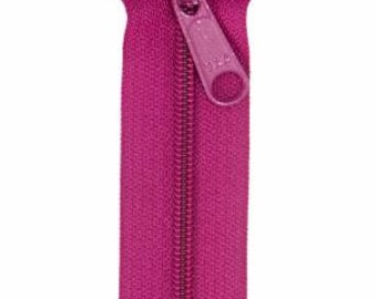 May include: A pink zipper with a metal slider. The zipper is closed and the slider is in the up position.