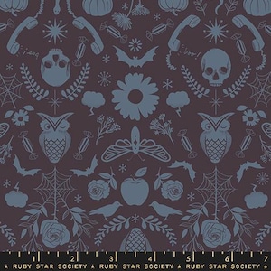 May include: A dark purple fabric with a repeating pattern of blue owls, butterflies, pumpkins, skulls, stars, and other Halloween-themed imagery. The fabric also features the text "boo!" and "j-ooo!"
