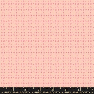 May include: A fabric with a repeating pattern of small, pink dots arranged in a grid-like design on a light peach background. The fabric has a textured appearance and is suitable for various sewing projects. The text "RUBY STAR SOCIETY" is at the bottom.