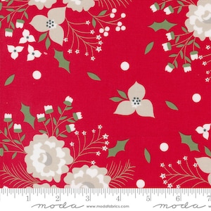 May include: Red fabric with a floral pattern featuring large, light beige flowers, white star-shaped accents, and green holly leaves. The fabric has a ruler along the bottom with the word "moda" printed on it.