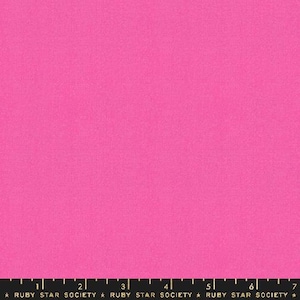 May include: Solid pink fabric with a subtle texture. The fabric is a bright, vibrant pink color.