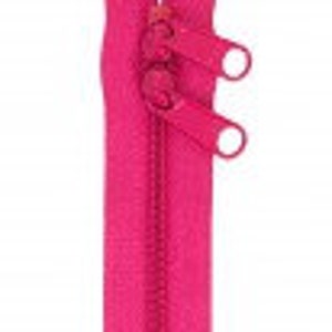 May include: A bright pink zipper with metal teeth and a pull tab. The zipper is closed and has two metal rings at the top.