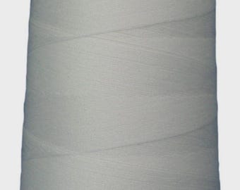 May include: A large spool of light gray thread, tightly wound and ready for use. The thread is a solid, neutral color, ideal for sewing, quilting, or other textile projects. The spool has a white top.