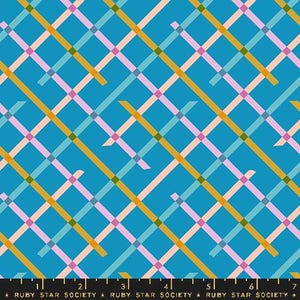 May include: A teal fabric with a repeating plaid pattern. The plaid design features intersecting lines in gold, light blue, pink, and green. The text "RUBY STAR SOCIETY" is printed at the bottom.