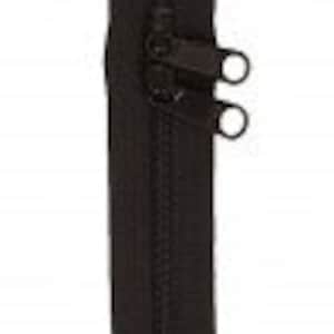 May include: Black zipper with two pull tabs. The zipper is closed and has a smooth finish.
