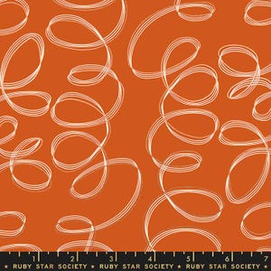 May include: Orange fabric with a repeating pattern of white, swirling lines. The fabric has a warm, inviting color and a playful design. The text "RUBY STAR SOCIETY" is printed at the bottom of the fabric.