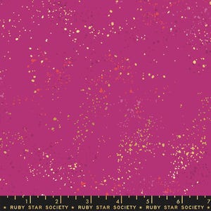 May include: A pink fabric with a scattered pattern of small gold and orange dots. The fabric is a repeating pattern and is suitable for quilting, crafts, and apparel.