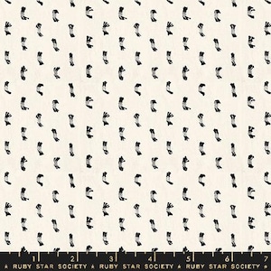 May include: White fabric with a repeating pattern of black stylized knots. The fabric is marked with a ruler in inches and the text "RUBY STAR SOCIETY".