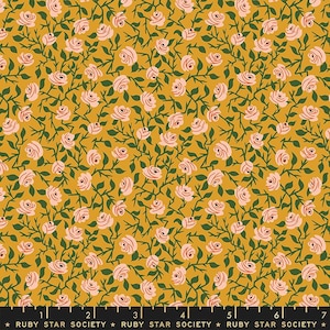 May include: A yellow fabric with a repeating pattern of pink roses and green leaves.