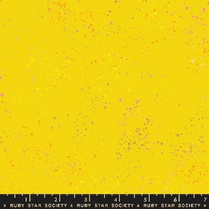 May include: Yellow fabric with a speckled pattern of small orange, pink, and gray dots. The fabric is a solid yellow color with a subtle texture.